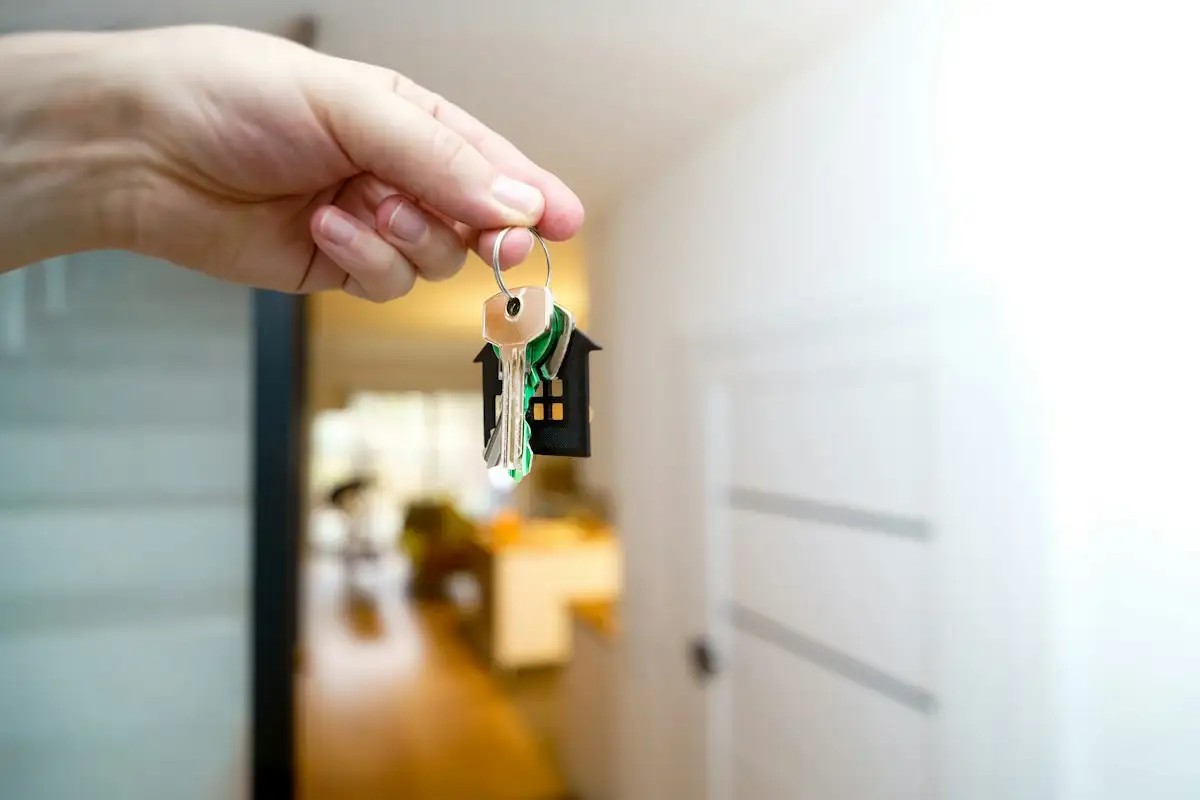 Tenant and landlord reviewing a tenancy contract's maintenance clause at a table